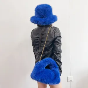Vibrant blue faux fur bucket hat and matching chain hobo bag set shown from the back