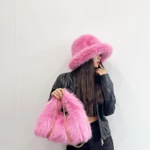 Fashionable pink faux fox fur bucket hat and matching hobo bag set with gold chain strap