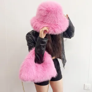 Detailed close-up showing the fluffy texture of the pink faux fur hat and bag set