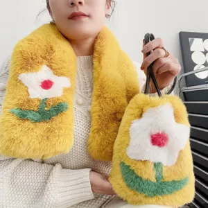 Close-up of fluffy yellow faux fur scarf and matching flower handbag set