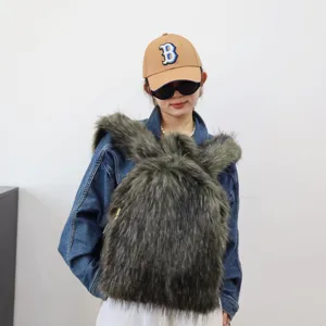 Stylish faux raccoon fur backpack in Y2K fashion style worn by a model in a studio setting