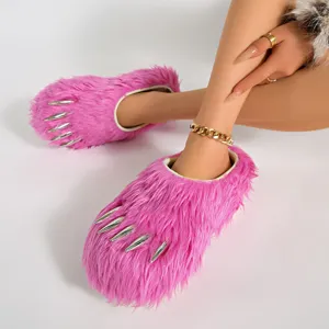 Close-up detail of pink furry claw slippers with silver metallic claw accents