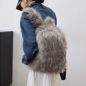 Detailed view of large grey fluffy faux fur backpack with rabbit ears on model