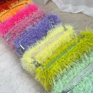 Close-up detail shot showing multiple colors of fuzzy faux fur chain shoulder bags.