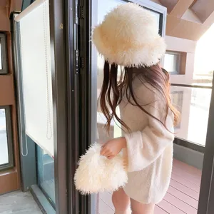 Cozy white faux lamb fur bucket hat with curly plush texture for autumn and winter.