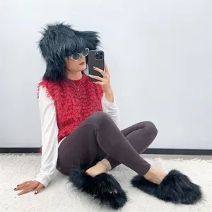 Detail of punk style faux raccoon fur hat and matching fluffy slippers on a model