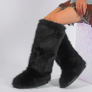 Close-up macro detail of the soft black faux fur texture on these high snow boots
