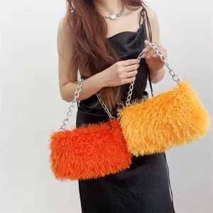 Chic plush faux fur baguette handbag featuring a chunky silver chain strap for stylish women