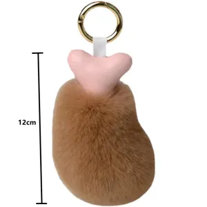 Detail view of a 12cm plush chicken drumstick keychain with soft faux fur texture.