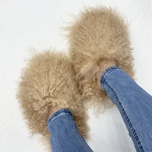 Detailed macro view of fluffy beige Mongolian fur slides featuring soft sheep wool