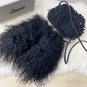 Detailed shot of black Mongolian sheep fur slides with a matching fuzzy handbag