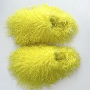 Detailed macro view showing the bright yellow Mongolian sheep fur texture on these fluffy slides