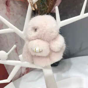 Close-up detail of a soft 8cm pink mink fur rabbit keychain charm with gold clasp