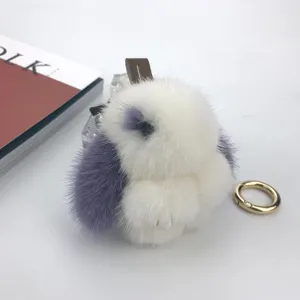 Close-up of fluffy white and purple mink fur rabbit keychain charm