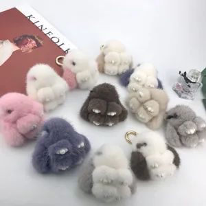 Set of soft mink fur bunny keychains in various colors including pink, grey and brown.