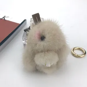 Detailed close-up showing the soft texture of a beige mink fur rabbit keychain charm