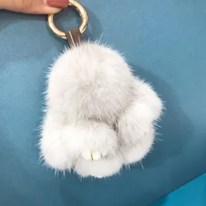 Detailed macro view of 8cm grey and white mink fur rabbit keychain charm with golden ring