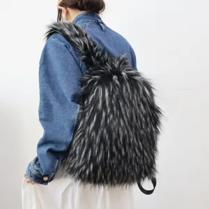Detailed back view of model wearing a large black and grey faux raccoon fur backpack