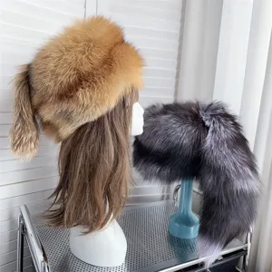Detail view of ethnic style winter fox fur hats with long fluffy tails