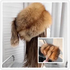 Detail view of luxury fox fur winter hat with tail, thick and warm for women's style