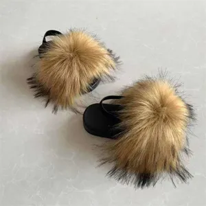 Detailed view showing the fluffy faux fur texture on these black kids' sandals with straps