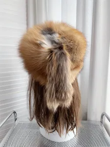 Detailed back view of a fox fur hat with a long tail, showing thick and fluffy fur texture.
