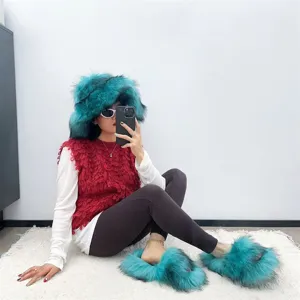 Stylish women's teal faux fur hat and matching fluffy slippers set in punk aesthetic