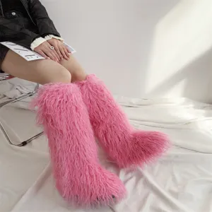 Macro view of fuzzy pink faux fur texture on fashionable knee-high winter boots