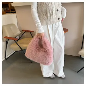 Elegant pink faux fur handbag for women, plush tote bag with soft texture for winter style