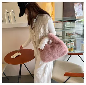 Detail of a pink fluffy faux fur tote bag in a cozy lifestyle cafe setting