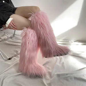 Detailed close-up of pink faux fur knee-high boots, soft texture and trendy winter design