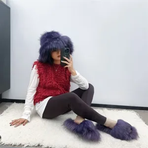 Stylish purple faux raccoon fur set with a plush bucket hat and matching slide slippers