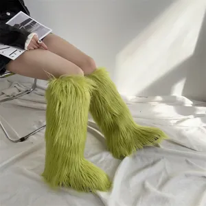 Detailed view of women's lime green faux fur knee-high snow boots in a studio setting.