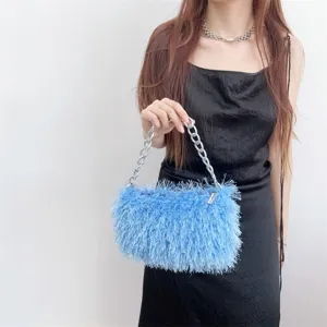 Fluffy light blue underarm bag with silver chain strap and shaggy faux fur texture