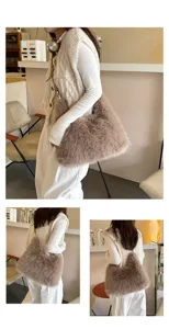 Cozy faux fur tote bag in light brown worn by model in a minimalist cafe setting.