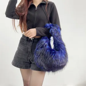 Stylish lifestyle shot of a blue and black faux fur hobo bag featuring a Y2K cool girl vibe.