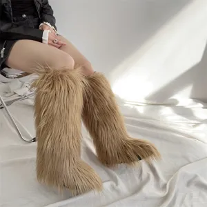 Close-up of camel-colored knee-high faux fur snow boots with long shaggy pile.