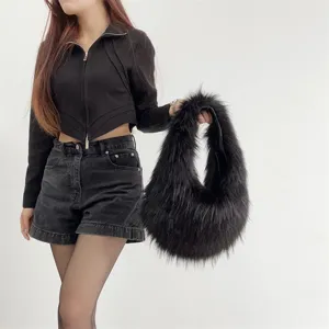 Fashionable black faux fur handbag shown in a trendy Y2K lifestyle street style.