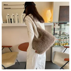 Macro view of plush faux fur hobo bag showing soft texture and shoulder strap detail.
