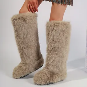 Cozy Y2K style knee-high snow boots featuring plush faux fox fur in a warm beige color