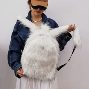 Close-up of fluffy white faux raccoon fur backpack with long-pile texture