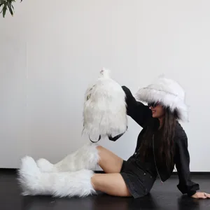 Stylish white faux fur backpack, bucket hat, and leg warmers set worn by an Asian model