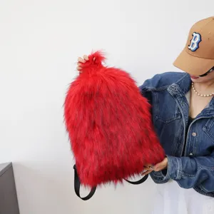Detailed macro view of a vibrant red faux fur backpack with trendy Y2K shaggy texture.