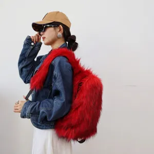 Detailed view of the bright red faux raccoon fur backpack with Y2K fashion style