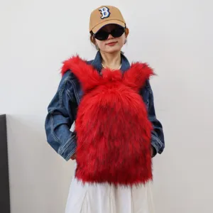 Close-up of red faux raccoon fur backpack showing fluffy texture and Y2K fashion style