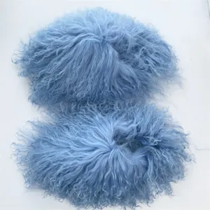 Close-up of premium light blue Mongolian sheepskin fur slides with soft fluffy texture