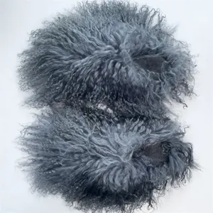 Detailed view of fluffy grey Mongolian sheep fur slides with thick curly wool texture