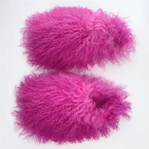 Detailed macro view of curly bright pink Mongolian sheep fur on fluffy winter slides