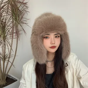 Detail view of a stylish faux fox fur Ushanka hat with fluffy earflaps for winter