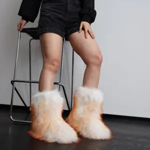 Model wearing fluffy white and orange gradient faux fur snow boots in a trendy Y2K style.